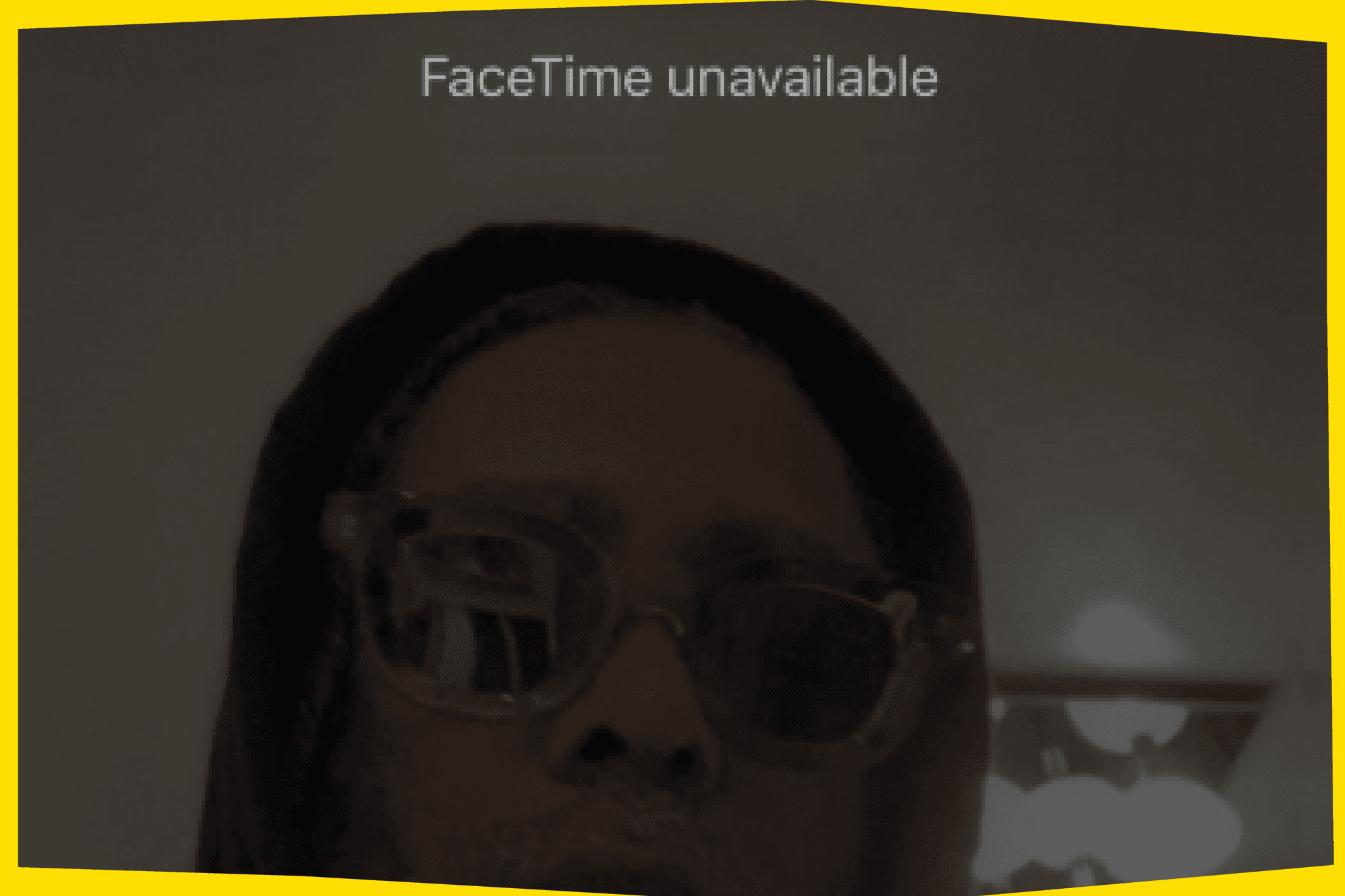 Arthur Jafa looks on in sunglasses and a black hoodie in a photo that looks like a screenshot from an iPhone. At the top it says "Facetime unavailable"