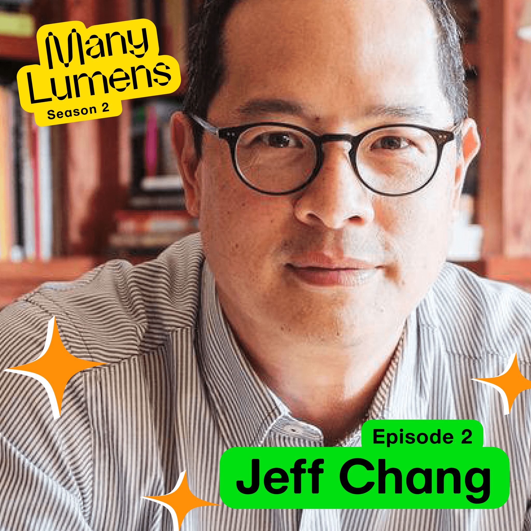 A headshot of Jeff Chang. He is wearing black-rimmed glasses and a pin-stripped button down shirt. He is looking at the camera with a slight smile on his face. Behind him is a bookcase. Many Lumens Season 2 Episode 1 Jeff Chang