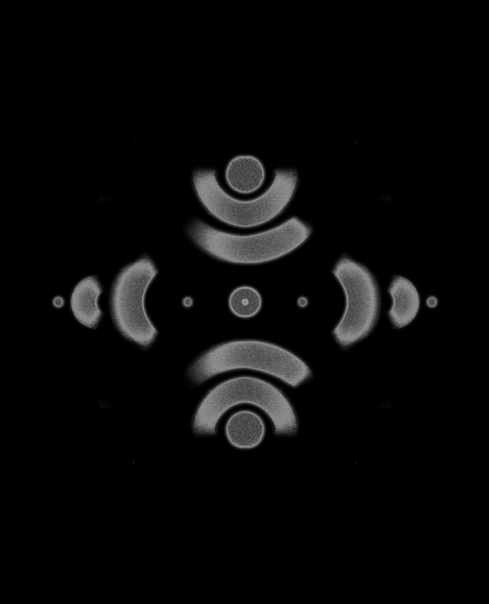 Abstract grey patterns with half-circles and dots create a diamond.