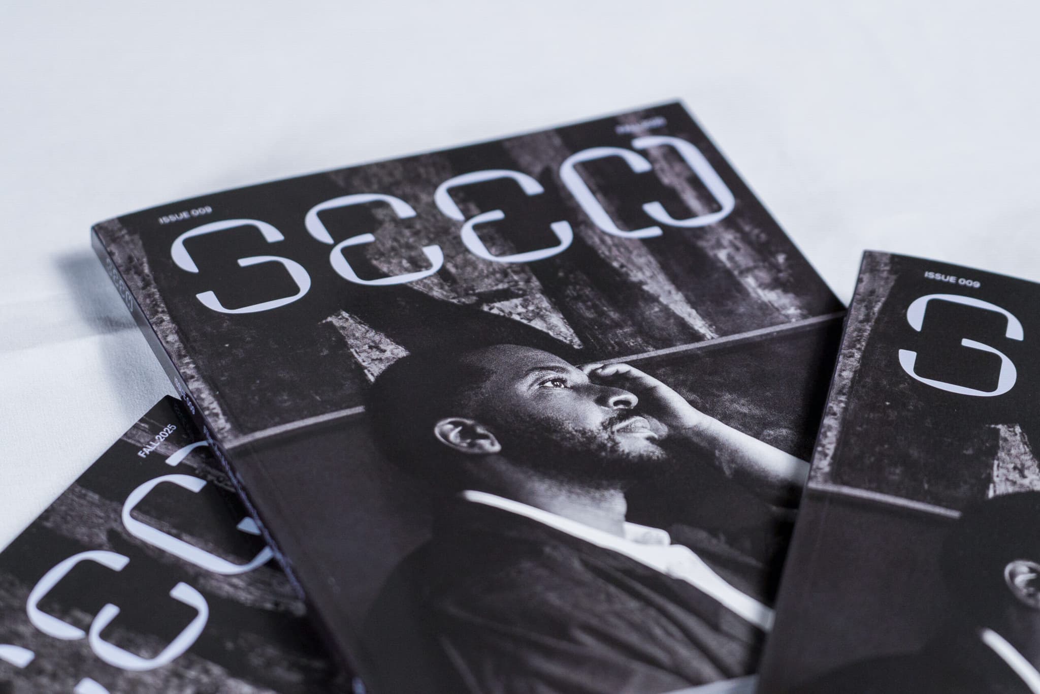 A photo of a several copies of Seen issue 009 laid out on a table.