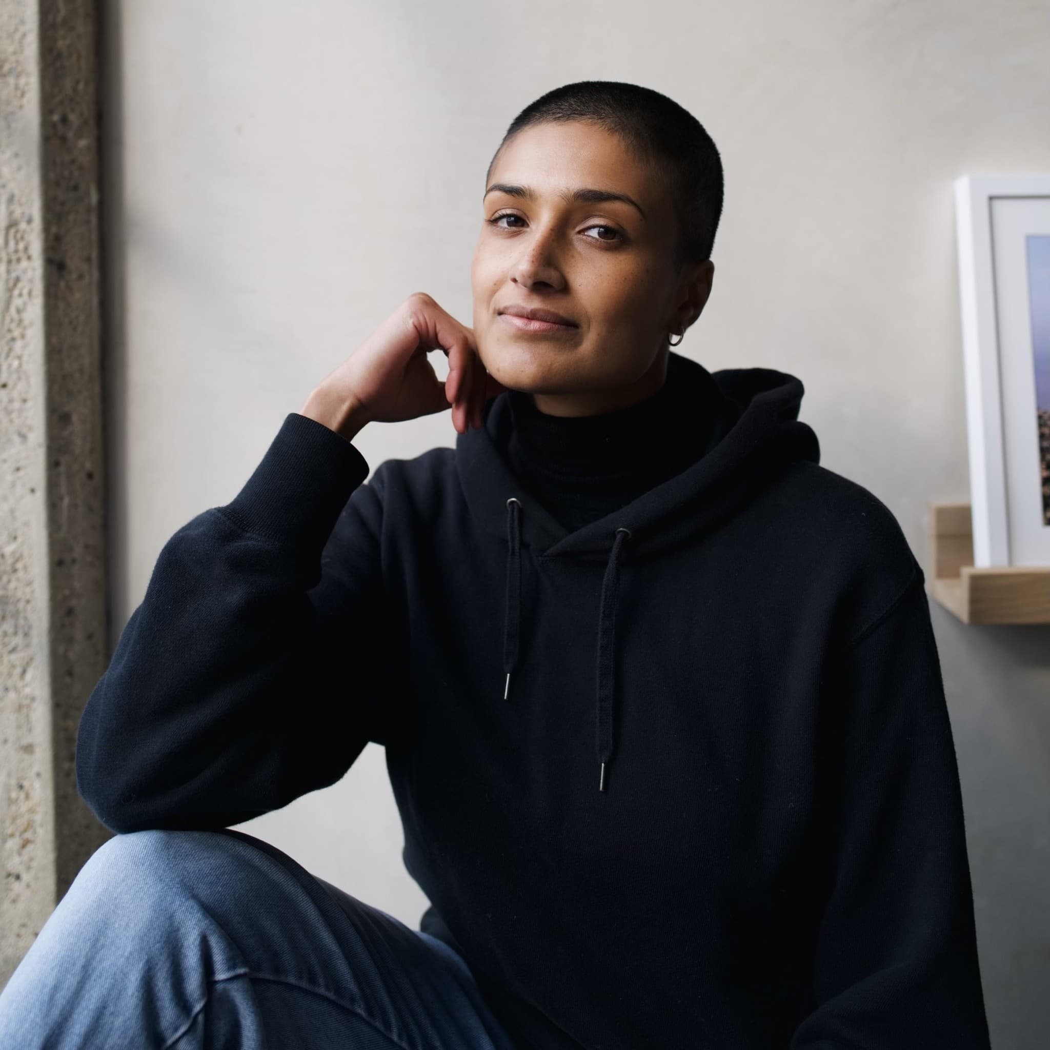 A photograph shows a portrait of Chloe Abrahams.