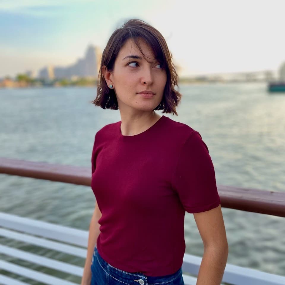 A photograph shows a portrait of Emily Hong.