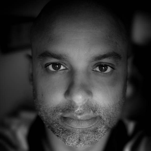 A photograph shows a portrait of Laurent Pantaleon.