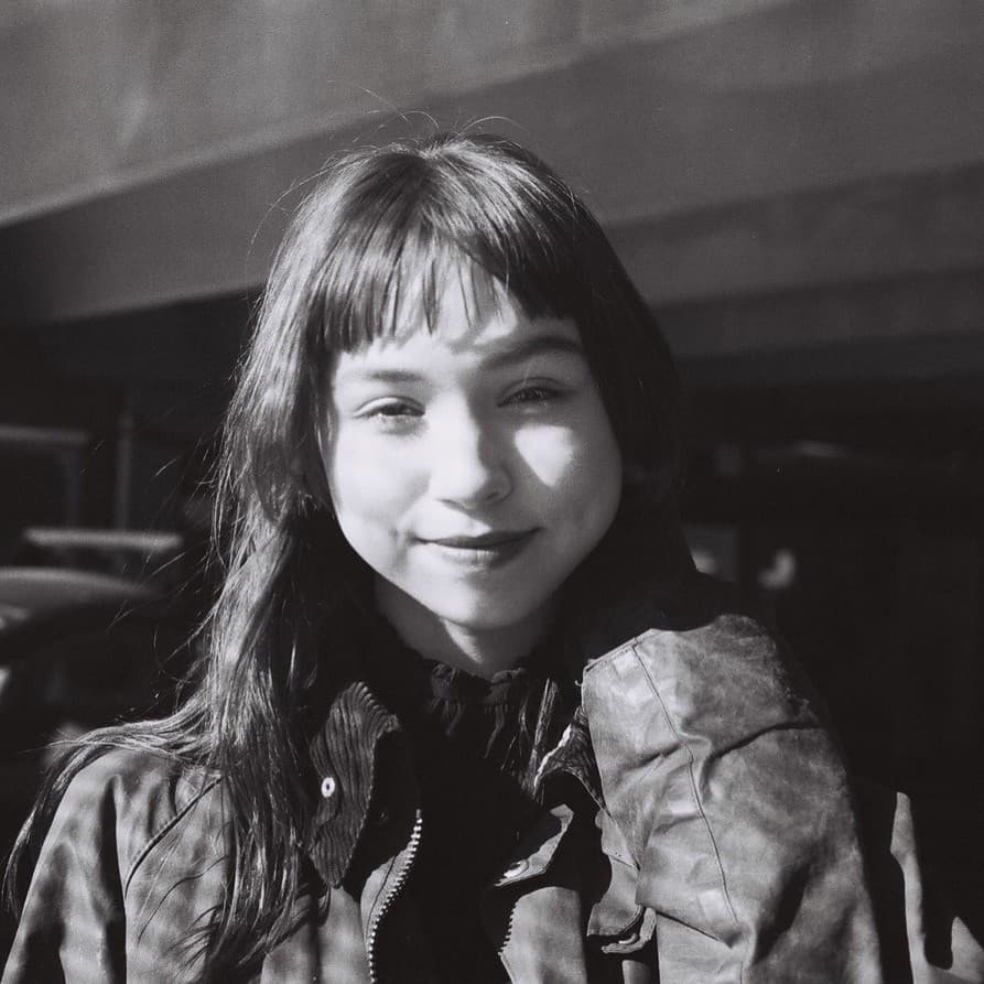 A photograph shows a black and white portrait of Megan Kyak Monteith.
