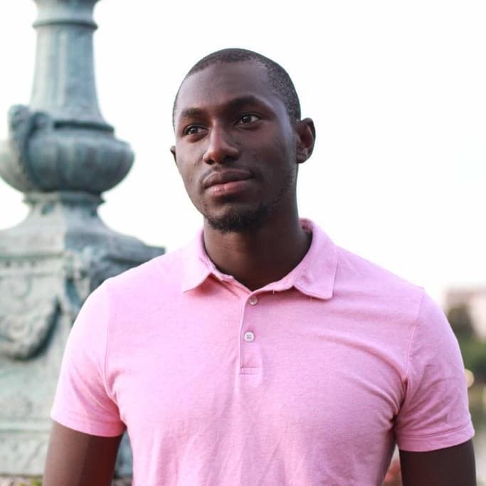 A photograph shows a portrait of Demba Konate.