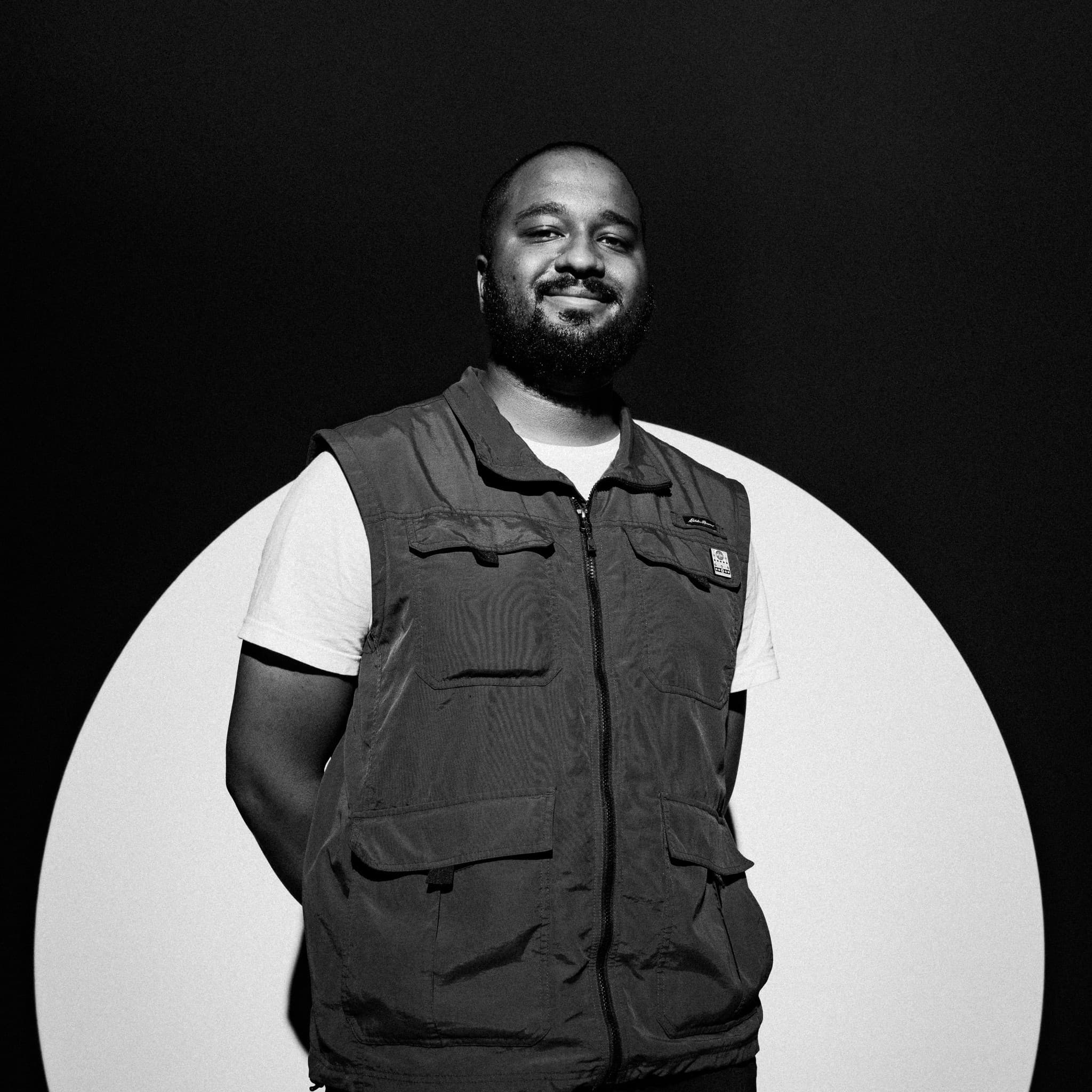 A photograph shows a portrait of Travis Wood.
