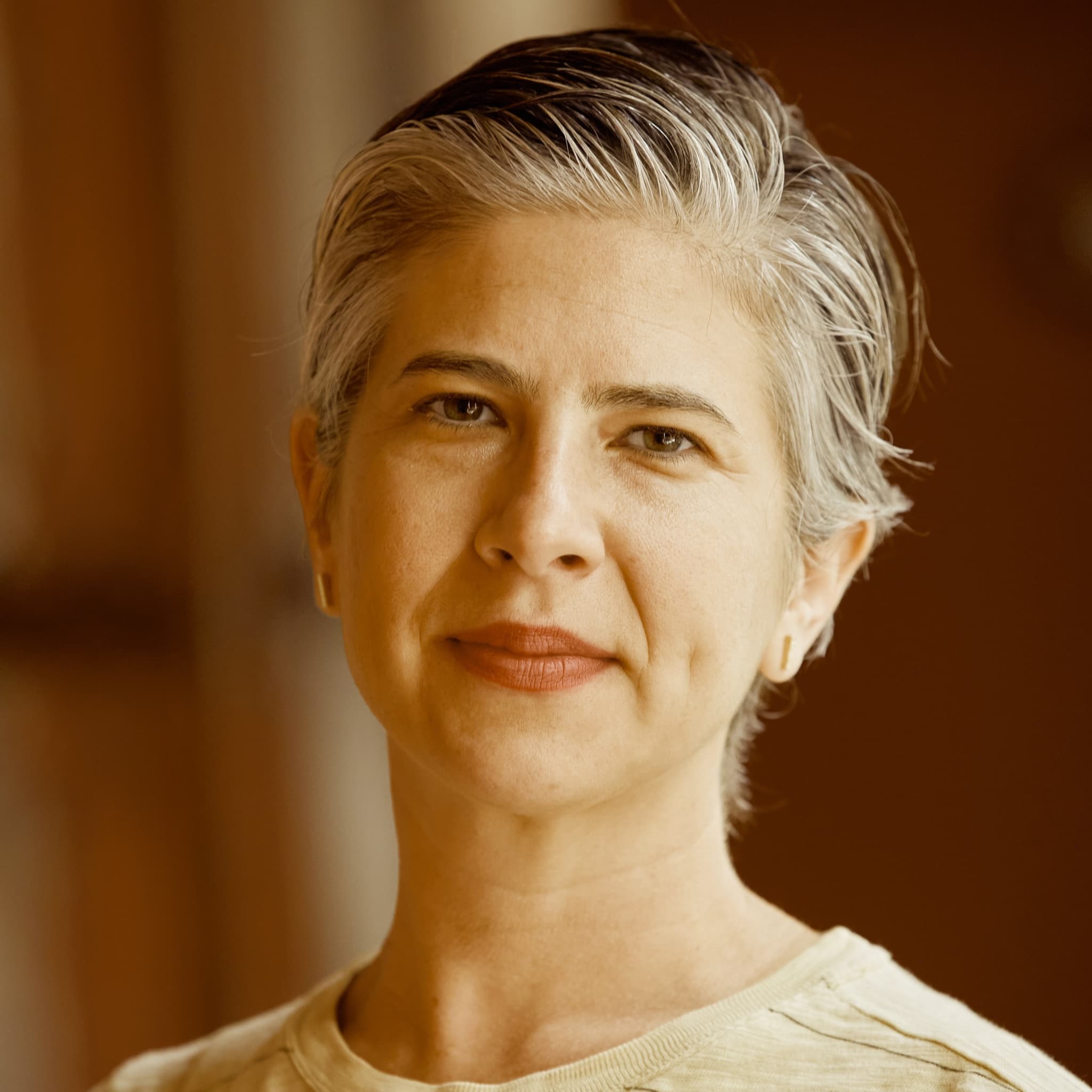 A photograph shows a portrait of Emily Cohen Ibañez.