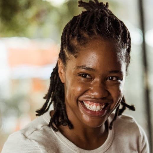 A photograph shows a portrait of Shanrica Evans.