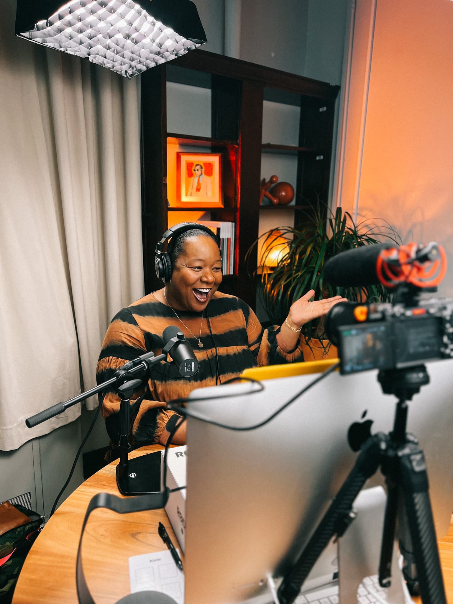 A photo of Maori Karmael Holmes recording an episode of Many Lumens