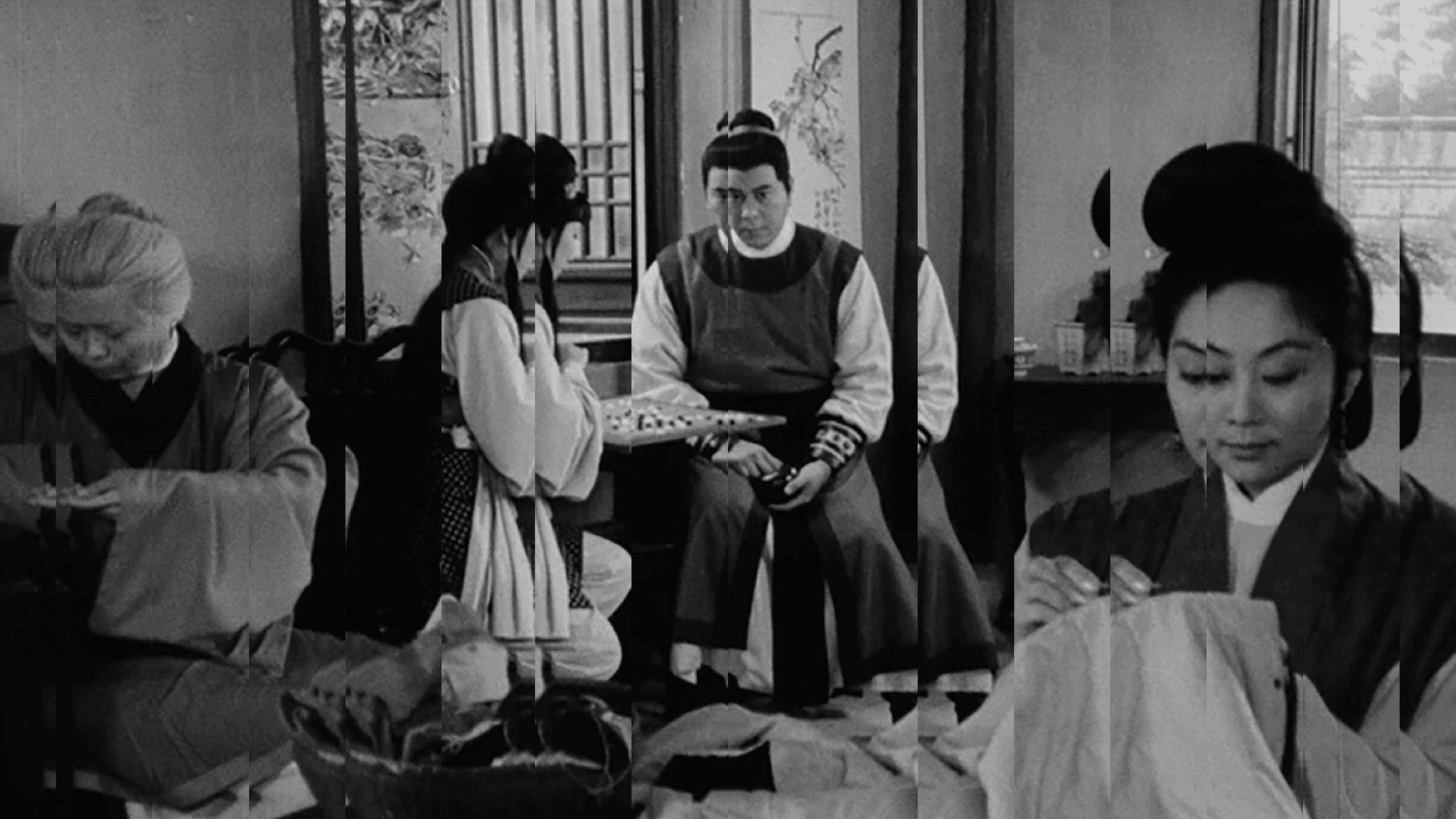A black-and white still from The Arch (1968), dir. T'ang Shushuen of a group of people in a salon type setting in China. Two are playing a table game and one is sowing a cloth. The image is manipulated so that the pieces of the frame are slightly different.